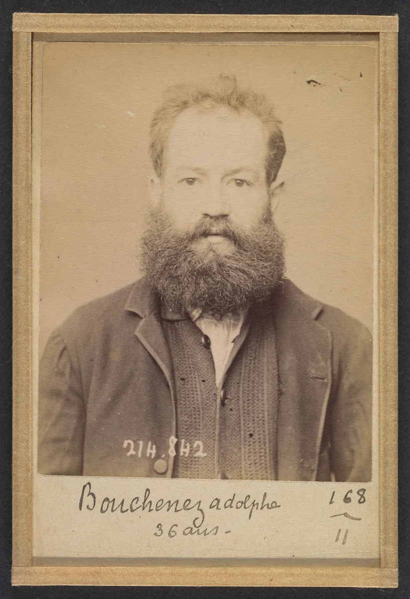 Bouchenez. Adolphe. 36 ans, 27/2/94. (En rouge barrant la fiche: "Transféré à Mazas. À faire extraire"). by Alphonse Bertillon, photograph, 1894