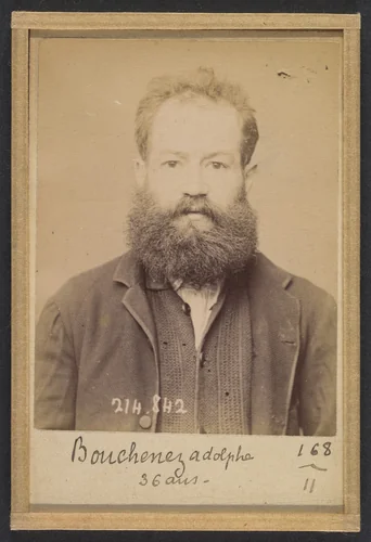 Bouchenez. Adolphe. 36 ans, 27/2/94. (En rouge barrant la fiche: "Transféré à Mazas. À faire extraire"). by Alphonse Bertillon, photograph, 1894