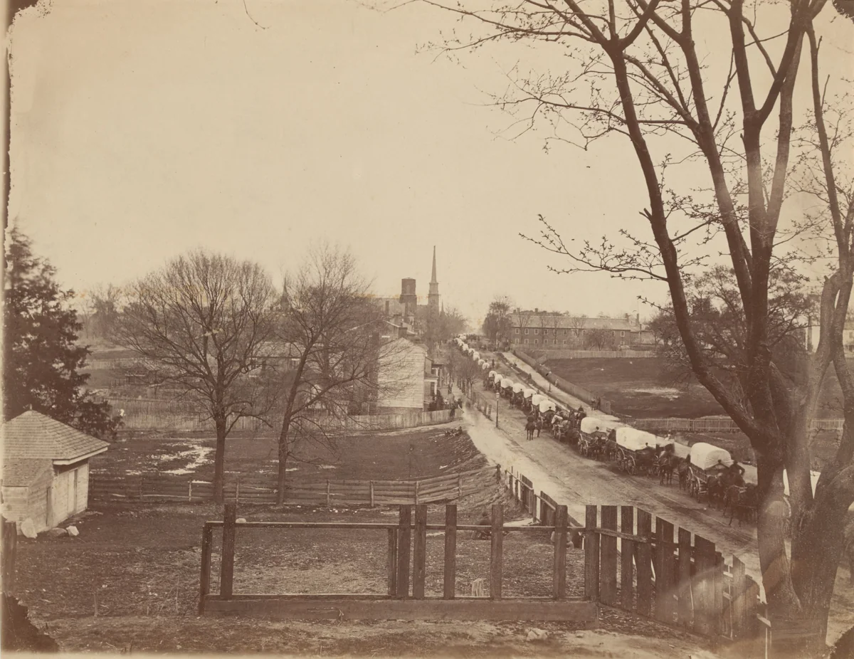 Train of Army Wagons Entering Petersburg, Virginia by John Reekie, photograph, 1865