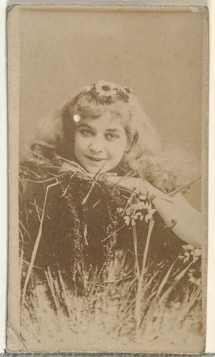 [Actress posing in grass with daisy in hair], from the Actors and Actresses series (N145-8) issued by Duke Sons & Co. to promote Duke Cigarettes by W. Duke, Sons & Co., photograph, 1890-1895