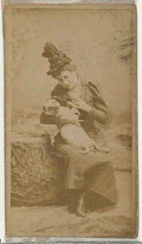[Actress cradling small dog], from the Actors and Actresses series (N145-8) issued by Duke Sons & Co. to promote Duke Cigarettes by W. Duke, Sons & Co., photograph, 1890-1895