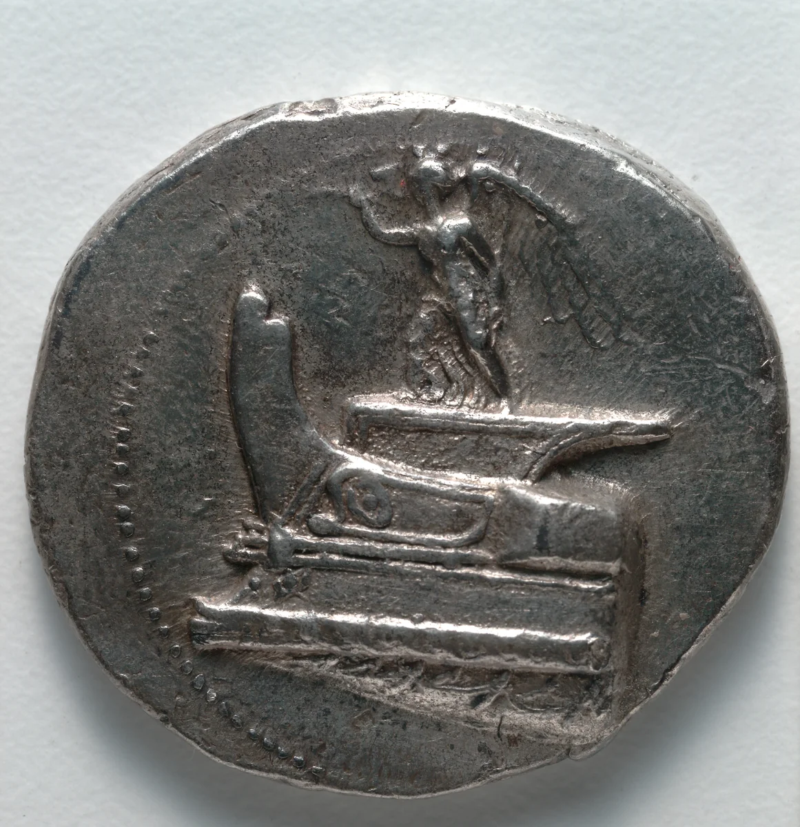 Tetradrachm: Nike on Ship's Prow, Blowing Trumpet (obverse) by Unknown, metalwork, -305--290