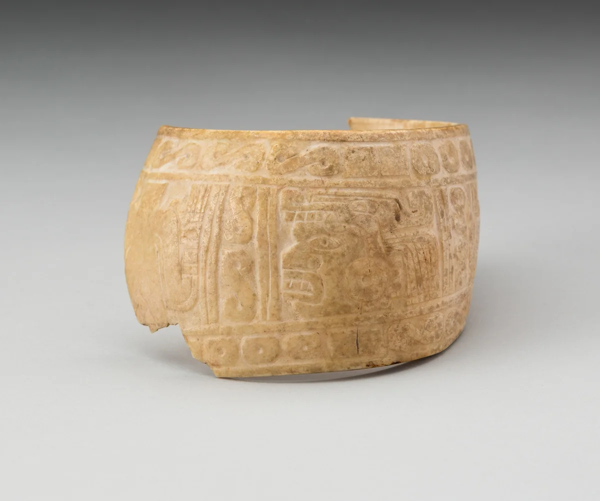Shell, Possibly an Arm Band, Incised with Profile Head Framed by Geometric Motifs (Fragment) by Mixtec, other, 1000-1400