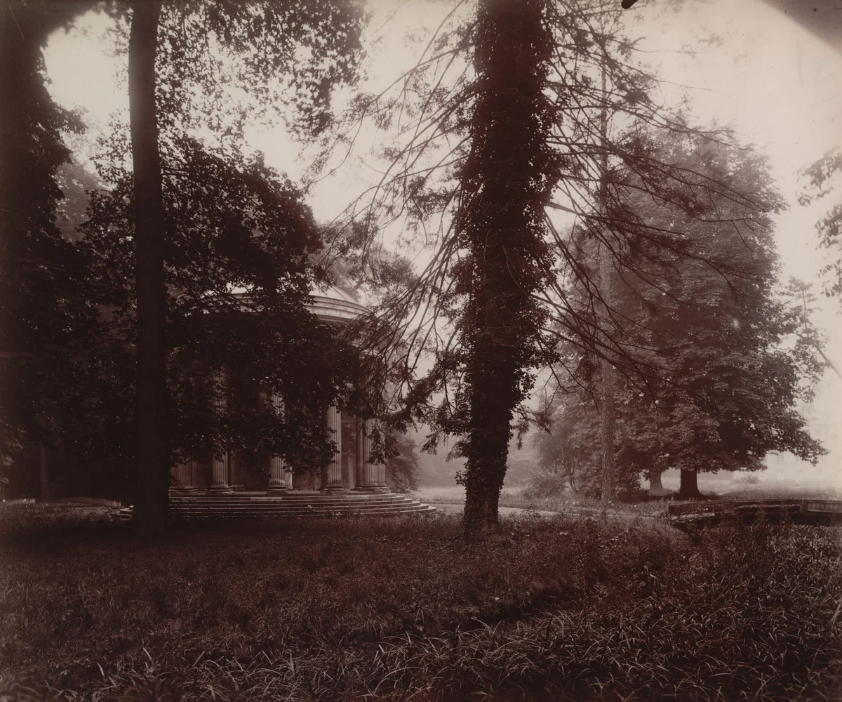 Grand Trianon, Le Temple de l'Amour à travers les arbres by Eugène Atget, photograph, 1923