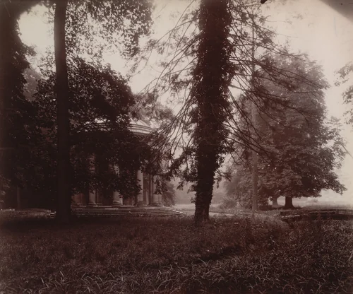Grand Trianon, Le Temple de l'Amour à travers les arbres by Eugène Atget, photograph, 1923