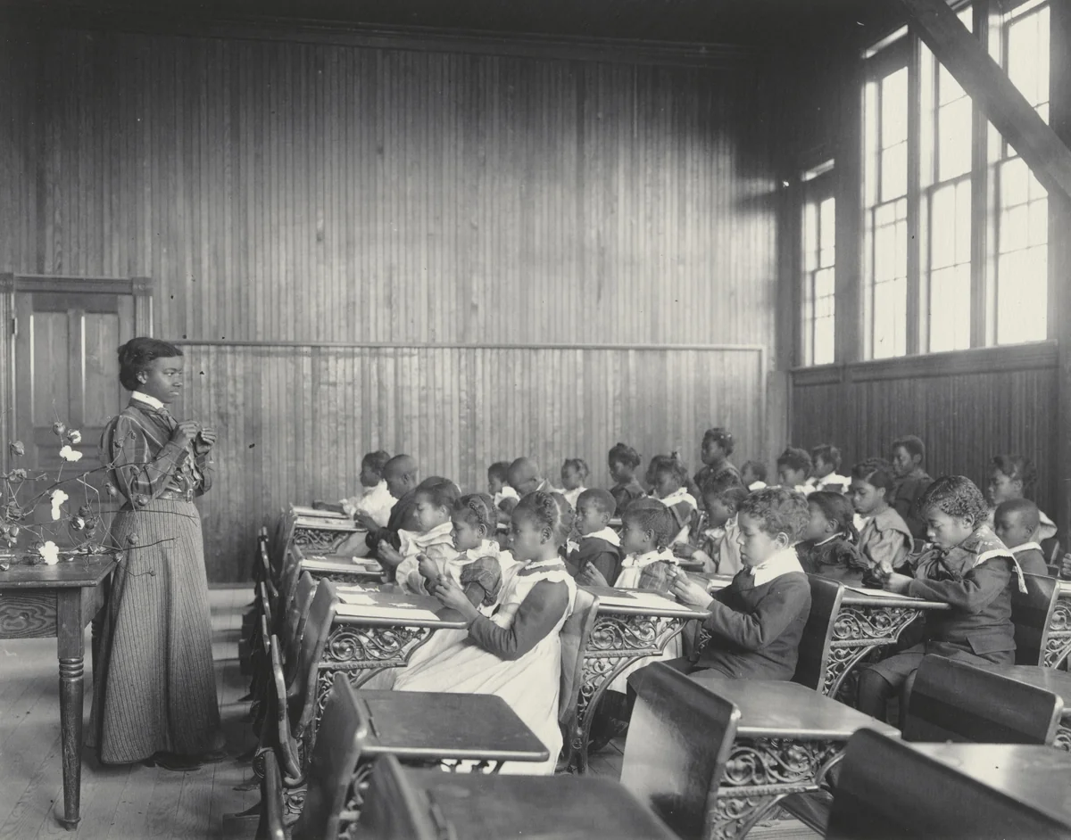 A sewing lesson at the Whittier by Frances Benjamin Johnston, photograph, 1899