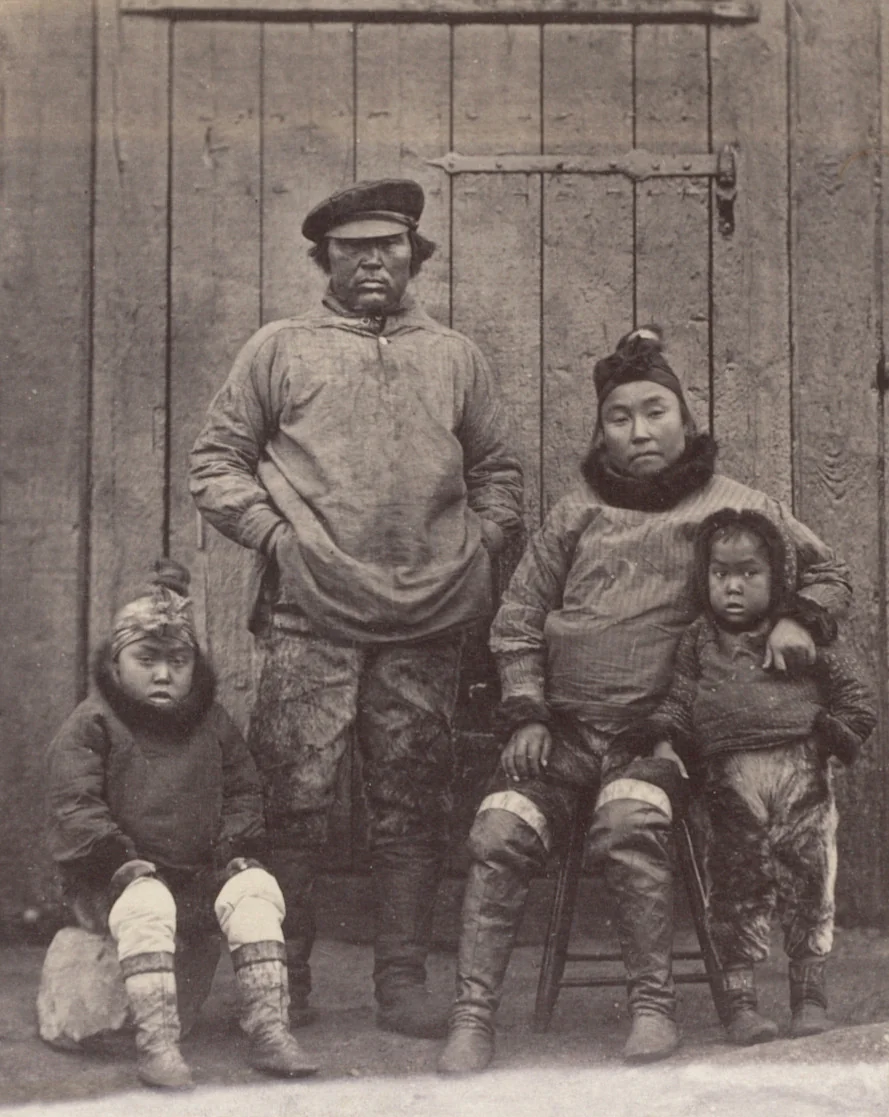 "Hans, his wife, and children. Hans was with Dr. Kanes in his expedition, also with Dr. Hayes in 1860 and 1861, and is now with the United States Exploring Expedition under Captain Hall." by George P. Critcherson, John L. Dunmore, William Bradford, photograph, 1869