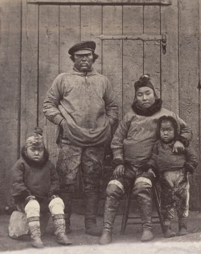 "Hans, his wife, and children. Hans was with Dr. Kanes in his expedition, also with Dr. Hayes in 1860 and 1861, and is now with the United States Exploring Expedition under Captain Hall." by George P. Critcherson, John L. Dunmore, William Bradford, photograph, 1869