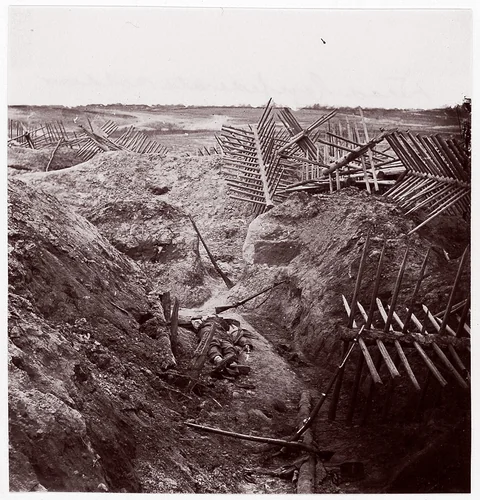 [Dead Confederate Soldier in the Trenches of Fort Mahone, Petersburg, Virginia] by Thomas C. Roche, photograph, 1865