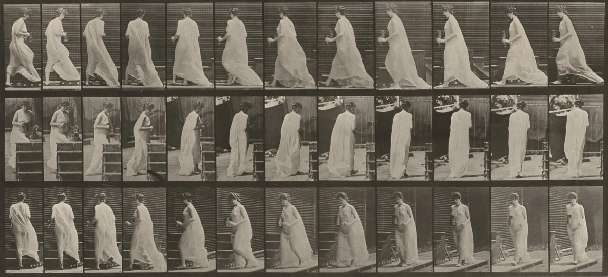 Plate Number 97. Turning to ascend stairs, with a pitcher and a goblet in hands by Eadweard Muybridge, photograph, 1887