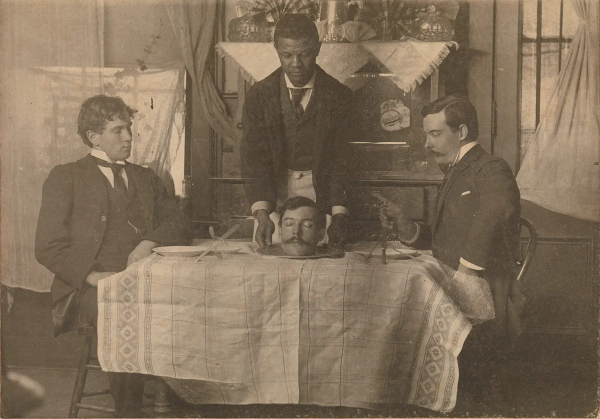 [Man Serving Head on a Platter] by William Robert Bowles, photograph, 1895-1905