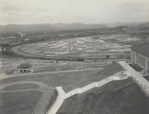Administration Building, Balboa, C.Z. Main entrance and plaza. Panama R.R. (6 degree curve) in the distance by Unidentified Photographer, photograph, 1915