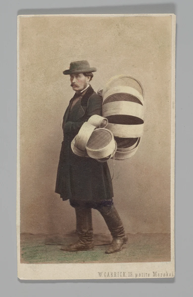 [Studio Portrait: Man in Coat Carrying Baskets, St. Petersburg] by William Carrick, photograph, 1860-1879