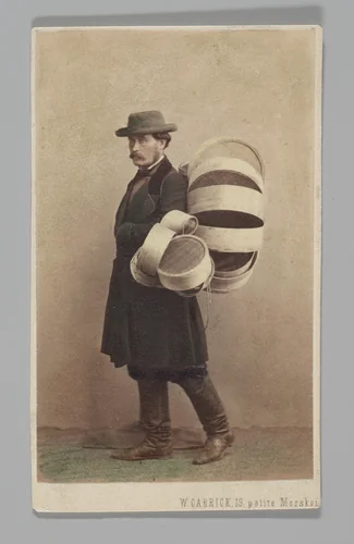 [Studio Portrait: Man in Coat Carrying Baskets, St. Petersburg] by William Carrick, photograph, 1860-1879