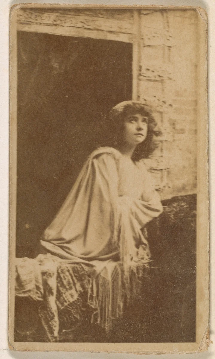 Actress posed in open window, from the Actresses series (N245) issued by Kinney Brothers to promote Sweet Caporal Cigarettes by Kinney Brothers Tobacco Company, photograph, 1890