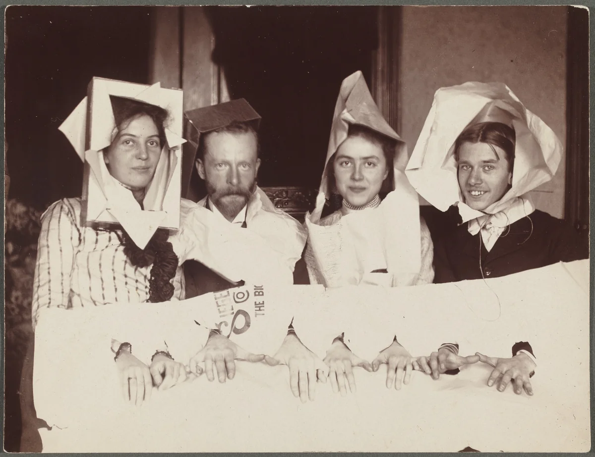 Untitled (Four men and women in paper costumes) by American 20th Century, photograph, 1900-1920
