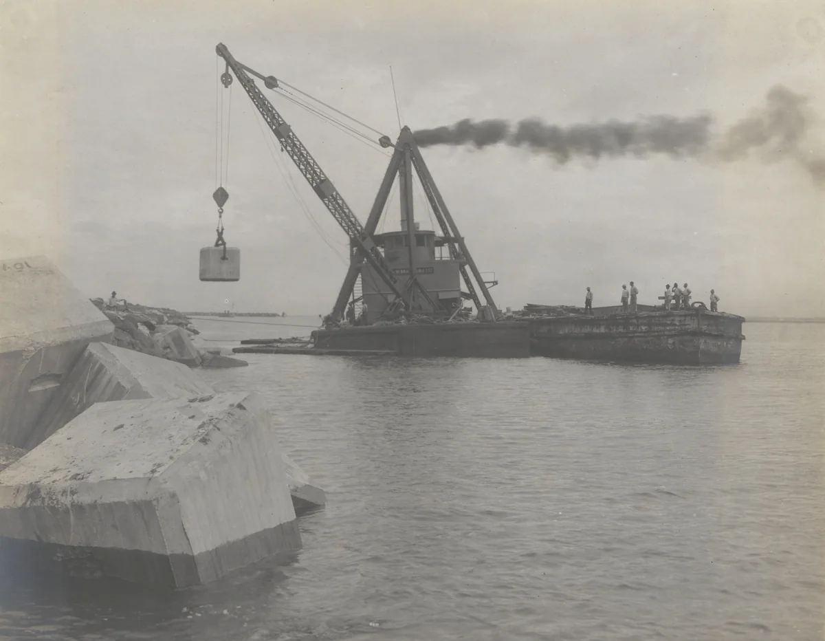 Toro Point Breakwater. Derrick barge placing 25-ton concrete blocks on bay slope by Unidentified Photographer, photograph, 1915