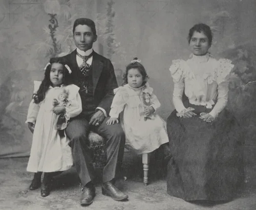 With Education. Kate H. McCaw and family. A Hampton Graduate by Frances Benjamin Johnston, photograph, 1899