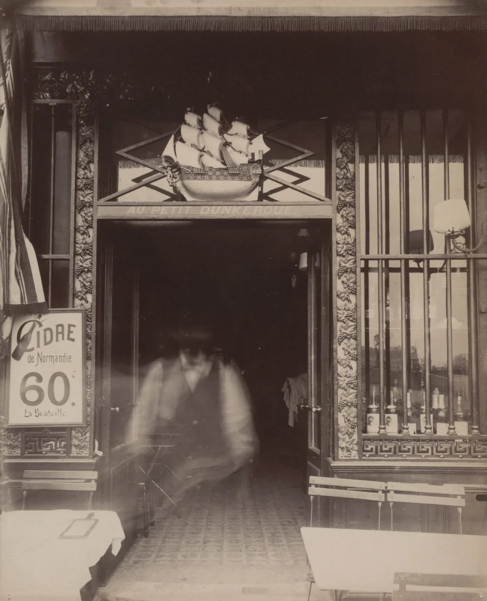Au Petit Dunkerque, 3 quai Conti by Eugène Atget, photograph, 1900