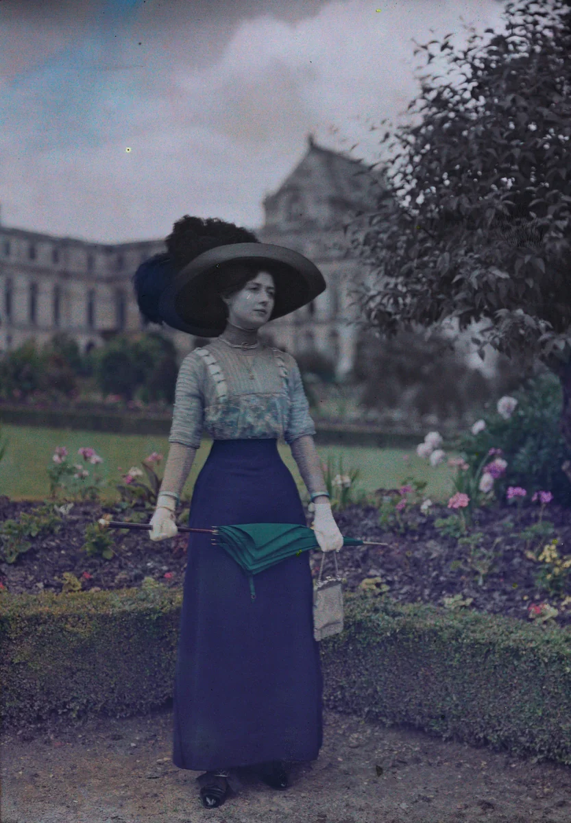 Woman with Umbrella in Garden by French 20th Century, photograph, 1910