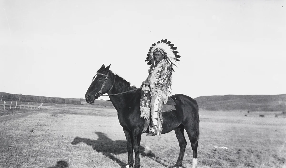 George Whirlwind Soldier as an Indian on Horseback by Eugene Buechel, photograph, 1925