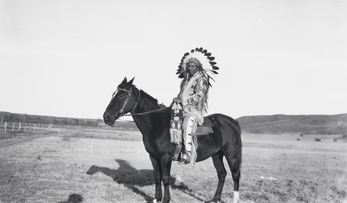 George Whirlwind Soldier as an Indian on Horseback by Eugene Buechel, photograph, 1925
