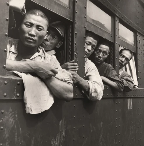 Japanese Soldiers and Civilians Crowd Trains to Tokyo at a Hiroshima Station after the Demobilization of the Japanese Military, Hiroshima, Japan by Wayne Miller, photograph, 1945