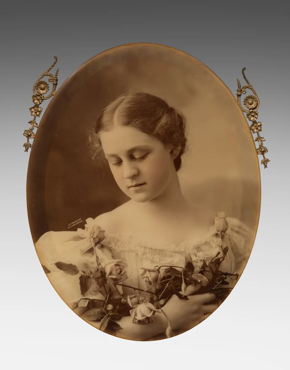 Young Woman Holding Roses by James Arthur, photograph, 1897