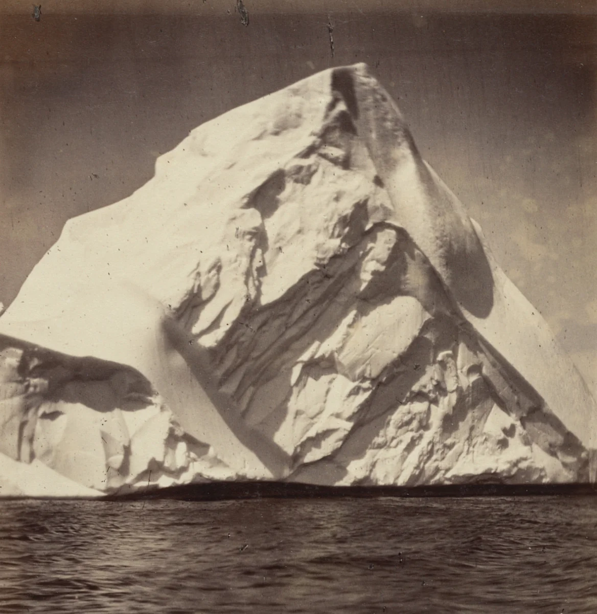 "Iceberg grounded near the land" by George P. Critcherson, John L. Dunmore, William Bradford, photograph, 1869