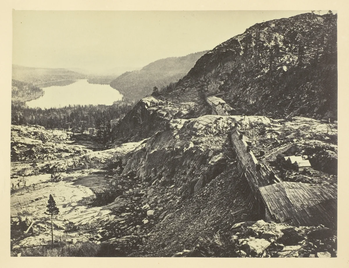 Summit of Sierra Nevada, Snow Sheds in Foreground, Donner Lake in the Distance, C. P. R. R. by Andrew J. Russell, photograph, 1868-1869