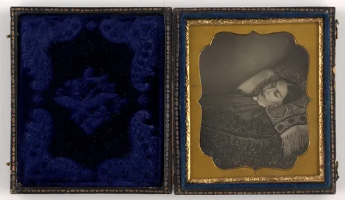 Death Portrait of a Woman Lying On a Bed of Patterned Material by Unidentified Photographer, photograph, 1850